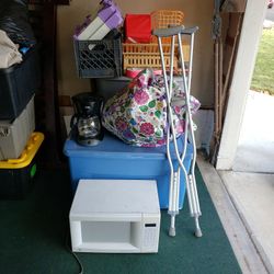 A Mixture Of Used Clothes And Small Appliances