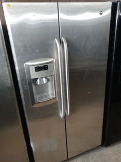 GE  stainless steel side by side refrigerator - Free delivery