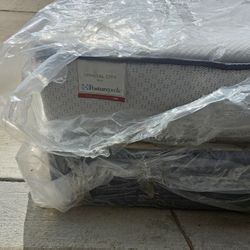 Queen size Sealy Posturepedic mattress with matching box spring set