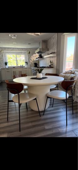 CB2 concrete table w 4 leather seat chairs w wood backrests