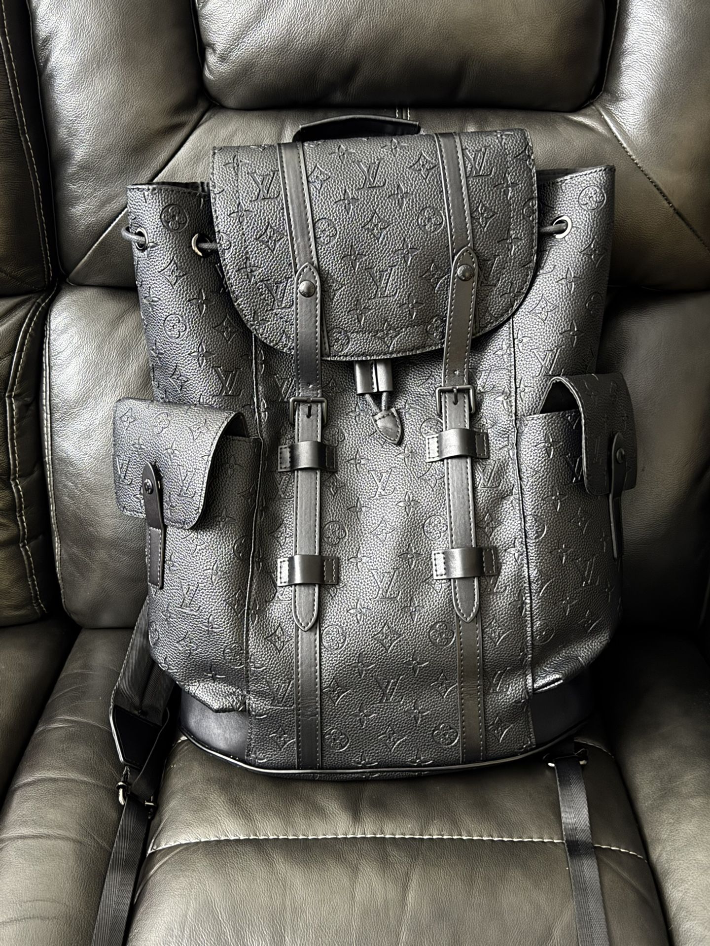 LV Christopher Monogram Tourillon Leather