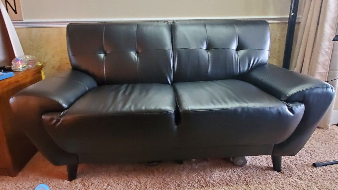 MCM Sofa and Love seat. Black artificial leather