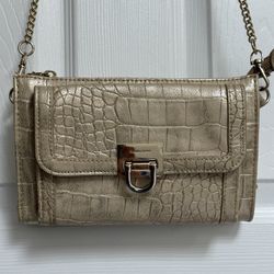 Gold Ivanka Trump crossbody bag.