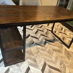 Arhaus Wood and Metal Desk in Very Good Condition Slight wear on one edge Measures 55”w x 30”h x 29”d Smoke free household