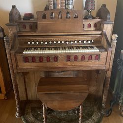antique reed organ, a pump organ, parlor organ