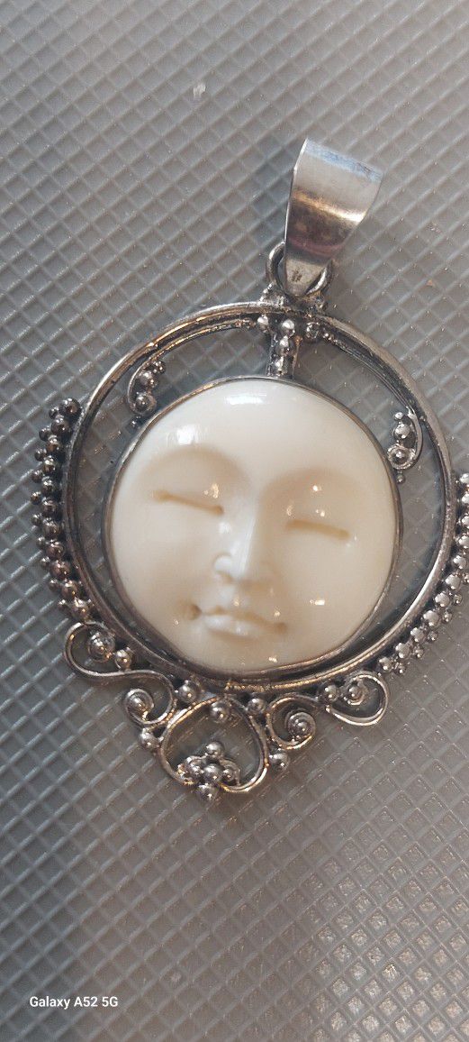 Carved Moon Face Pendant 