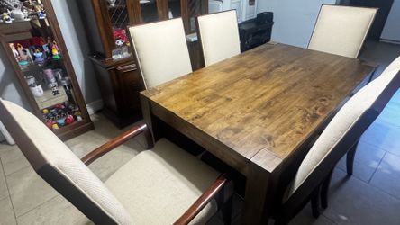 Brown dinning table with 6 chairs