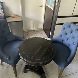 Blue accent chairs with dark brown table