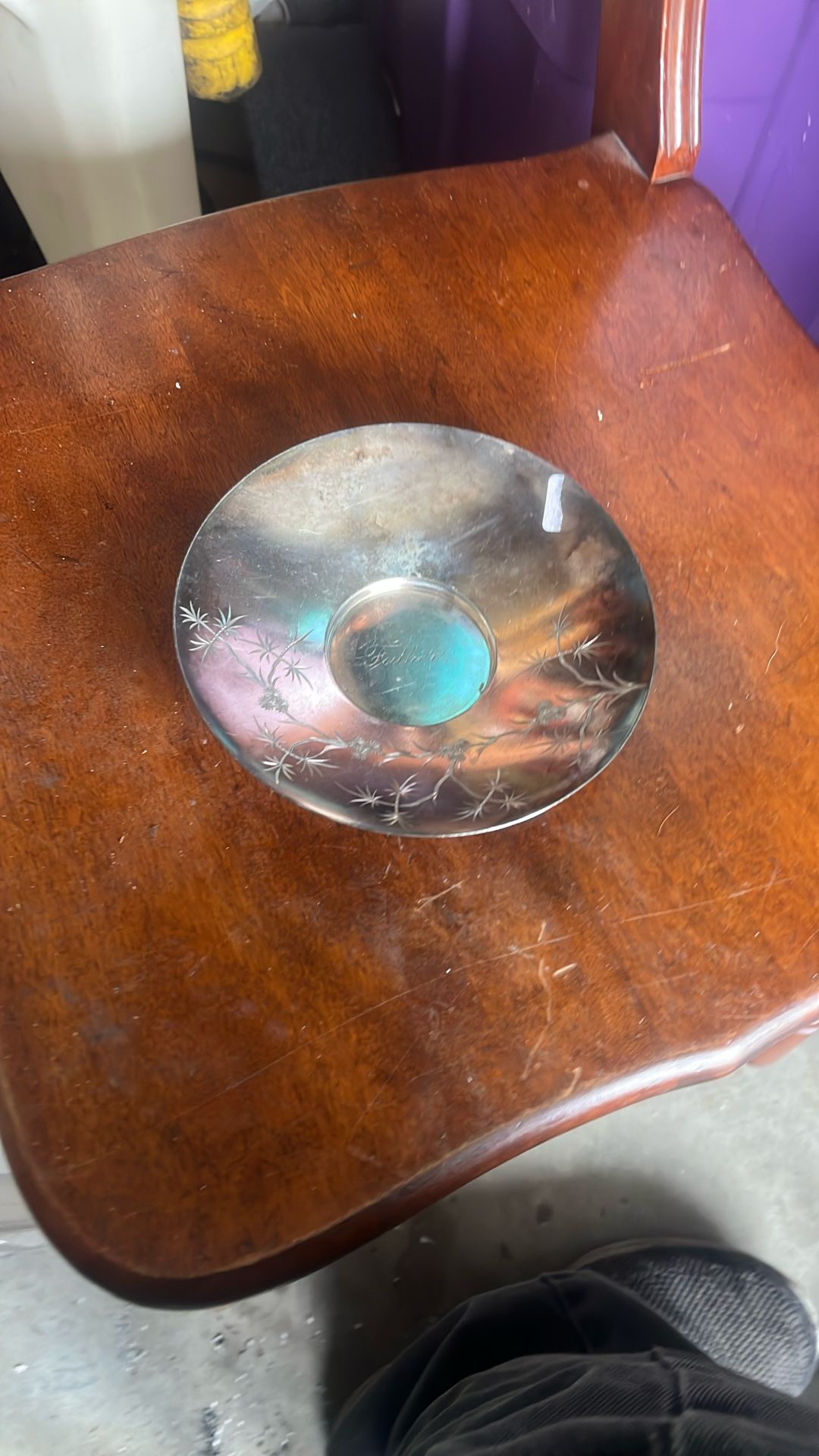 This is a vintage silver-plated mustache cup saucer made by James W. Tufts of Boston. The company was known for its quadruple-plated silver hollowware