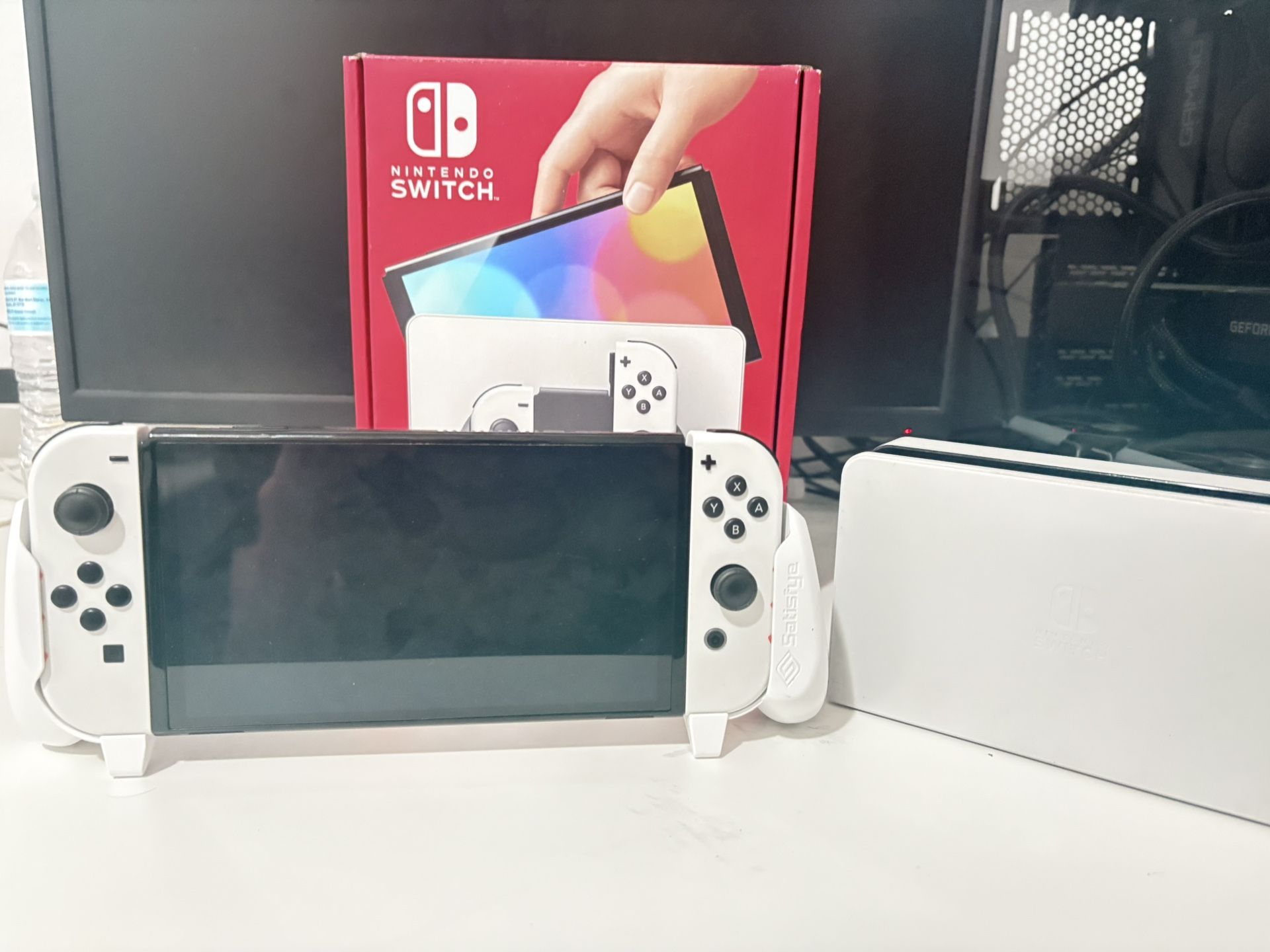 nintendo switch oled with grip and 128 gb extra