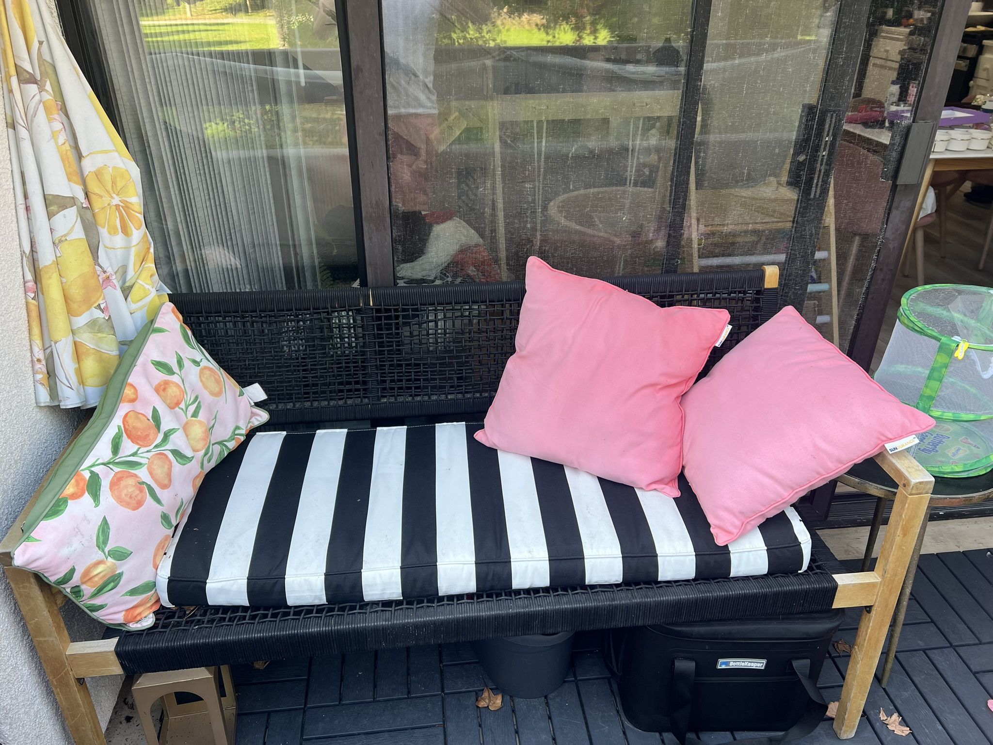 Black patio bench with cushions