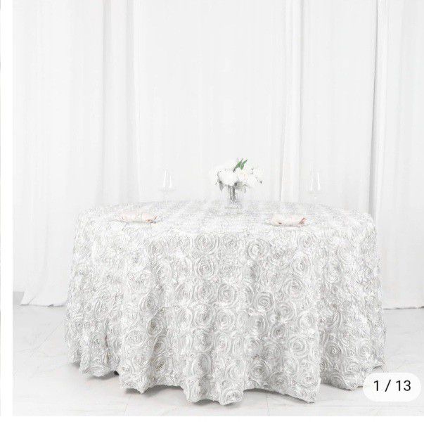 tablecloth 120 round 3 D roses with two covers for party chairs I sell it in ser for 45 dollars 