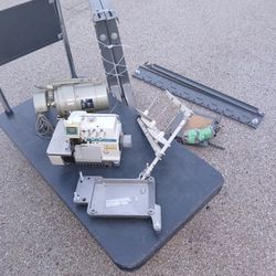 Industrial Serger Machine and table set up with motor.  Must Take the whole set up for it to work well. 