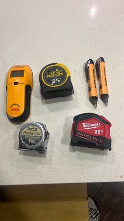 Measuring tape stud sensor in voltage tester