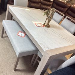 Brand new table and four chairs for $1000 the bench for $150