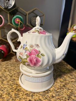 Teapot with warmer and cups