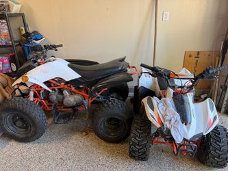Two White and Orange ATVs / Four Wheelers