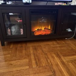 Fire Place Tv Stand. Used But Is Still In Good Condition And Works Perfectly 