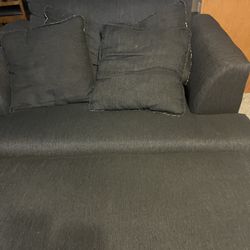 Blue king size love seat, three cushion couch, and ottoman 