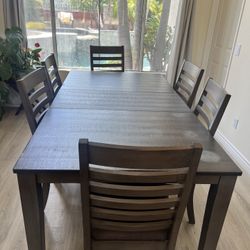 Brown Wood Dining Table with 6 Chairs – Good Condition