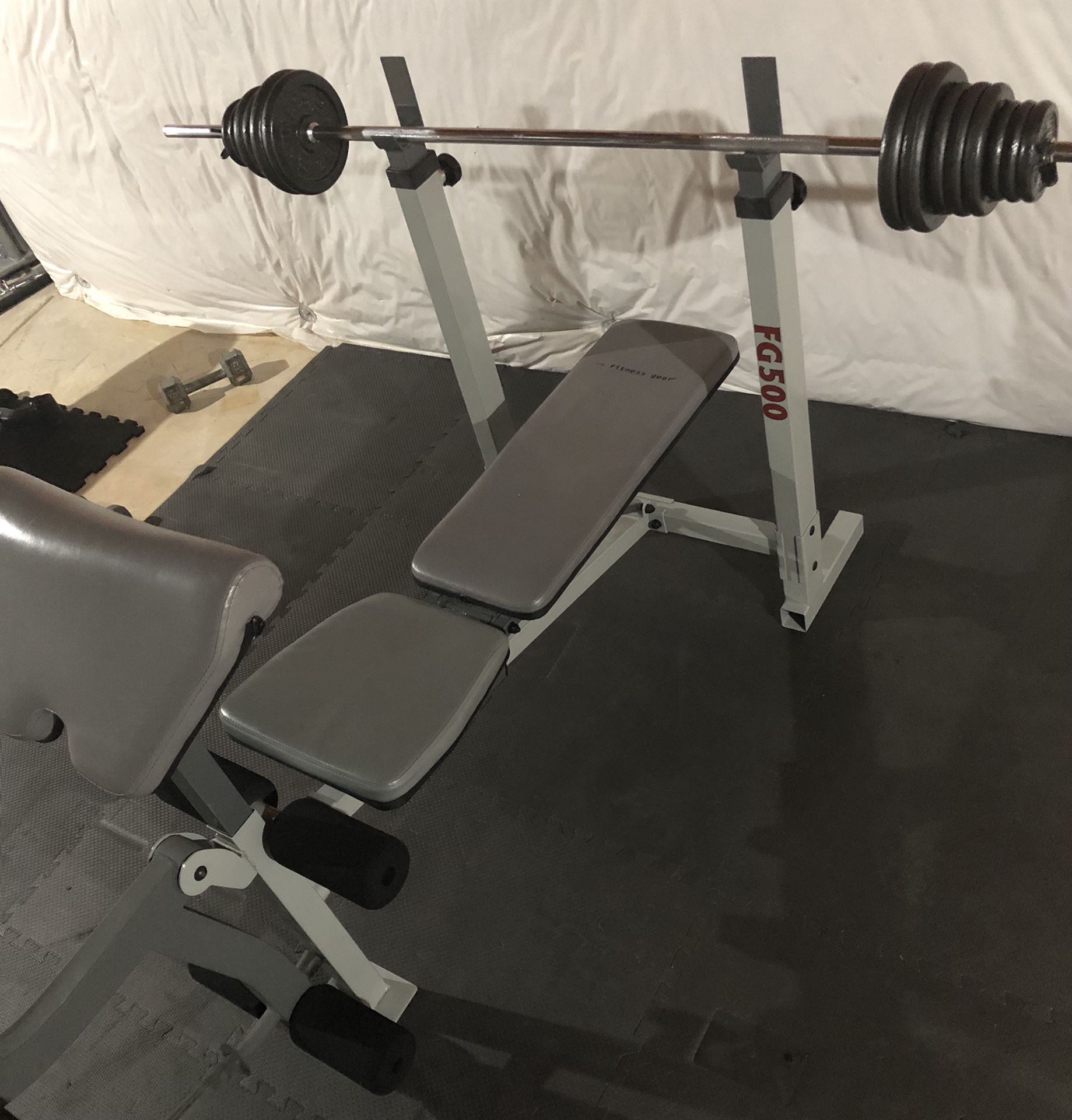 Fitness Gear FG500 weight bench with 4x10, 6x5, 6x2.5 = 16 plates = 85lbs and a bar