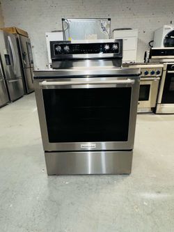 KitchenAid stainless steel stove; includes a receipt for a 90-day warranty.