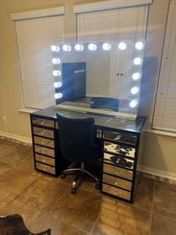 Vanity with lights and chair