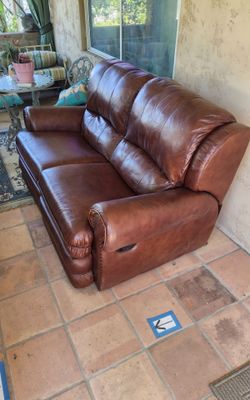 Double recliner brown leather works great