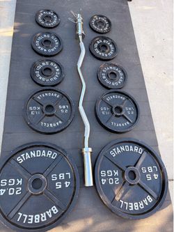 Olympic weights  with a curl bar and clips in good condition  comes with pair of 45s 25s  2 pairs of 10s and a pair of5 pounds  pick up in sun valley 
