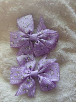Girls small bows $5 each pair new