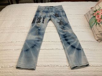 Amiri tie-dye distressed patch jeans