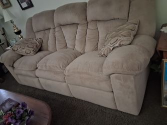 A couch both ends recline , in really good shape