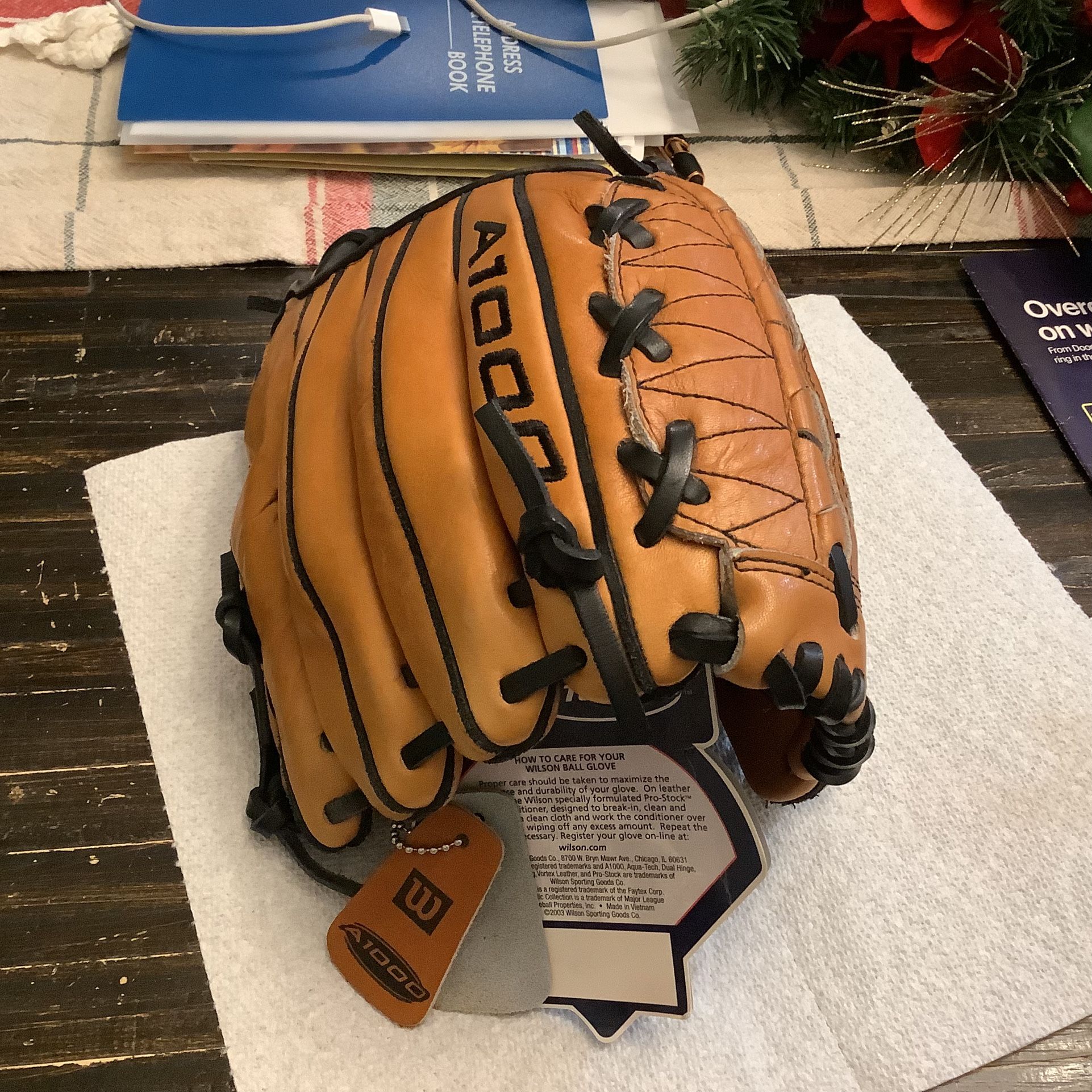 A1000 Wilson fielders glove model A1002L, this is catch with right hand and throw left This is a dual hinge, leather baseball glove 11.75”