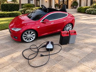 Radio Flyer 12V Model 910 Tesla Model S for Kids Ages 3-8, Includes 2 Batteries and Charger! Some cosmetic wear, including the back panel which needs 