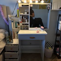 Vanity desk with mirror and lights