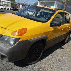 2001 Pontiac Aztec Yellow Outside And Grey Interior  6 Cylinder Fully Loaded With Sunroof Excellent Features Of Air Conditioning And Heating Also Heat