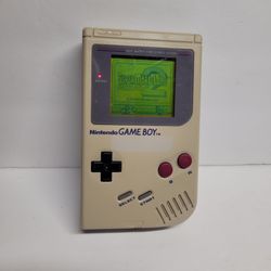 Vintage Nintendo Game Boy and Super Mario Bros cartridge