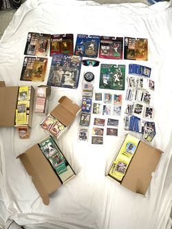 A Collection Of Sports Action Figures, And Lots Of Trading Cards And Other Collectibles