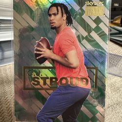 C.J. STROUD RC 2023 SKYBOX PREMIUM METAL UNIVERSE CHAMPIONS #S-23 ROOKIE CARD