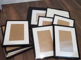 Several used black picture frames