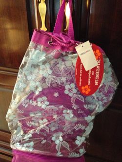 New drawstring bag with frisbee and paddle ball