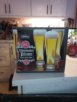 Libbey Rhinelander Pilsner glasses feature a tall, tapered design perfect for showcasing light beers.