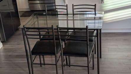 Glass dinning table with chairs