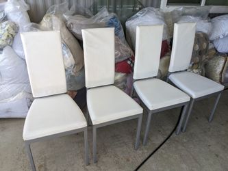 Set of 4 stackable leather white dining room chairs