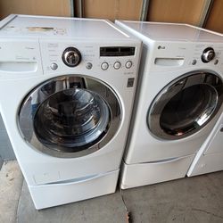 LG Front Load Washer And Stackable Gas Dryer Set With Pedestals 