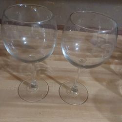 balloon wine glass or a large stemmed glass suitable for cocktails or gin and tonics. 