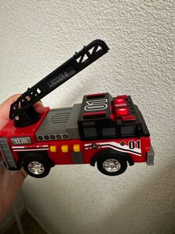 Firetruck toy that lights up and makes sounds