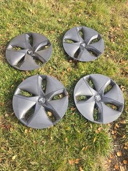 Tesla 4 hubcaps OEM