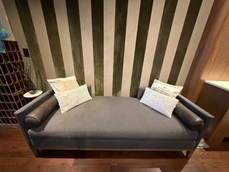Gray Upholstered Chaise Lounge with Leather Arms