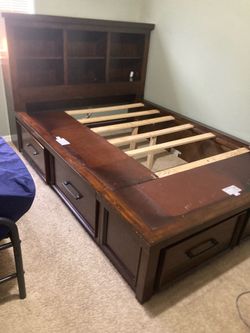 Full sized wooden bed frame